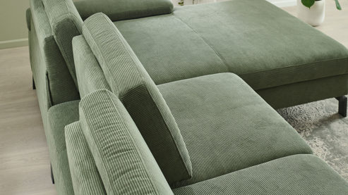 Ecksofa SOFAkultur aus Stoff in Grün SOFAkultur Programm SK 239 - Ecksofa mit Federkern olivgrüner Feincord & schwarze Metallfüße 192 - Stellfläche ca. 292 x 185 cm